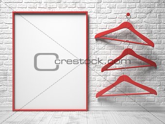 Three red cloth hanger and blank canvas