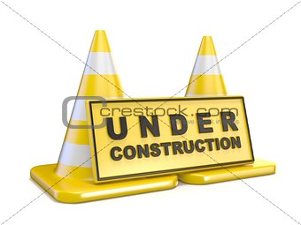 Yellow UNDER CONSTRUCTION sign and two road cones