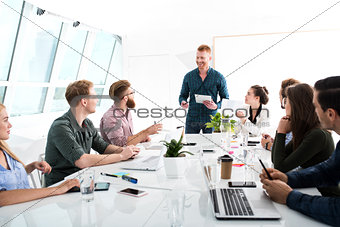 Team of businessmen work together in office. Concept of teamwork and partnership