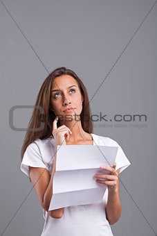 woman worried or thinking about the letter