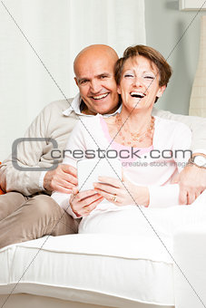 Happily married laughing middle-aged couple