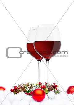 Red wine glasses with christmas decoration