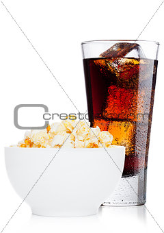 Popcorn salty sweet snack in white bowl with cola