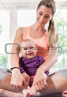 Mum and her baby child in pregnancy recovery course
