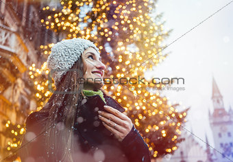 Woman enjoying Christmas time in the city