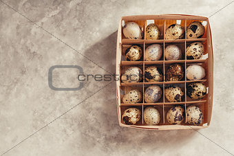 Quail eggs in a wooden box