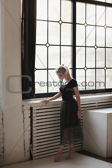 Ballerina near window