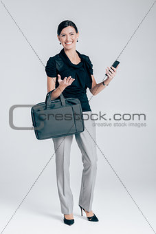 attractive business woman on gray background