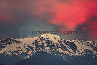 Sunset evening view over the snowy mountain peak