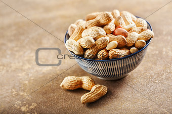 Raw peanuts in bowl