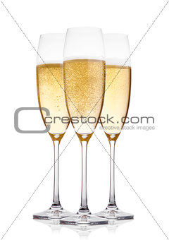 Yellow champagne glasses with bubbles isolated