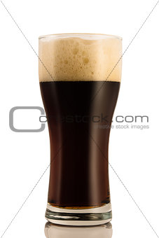 Dark beer in a glass, isolated on a white background