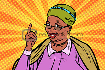 African elderly woman pointing finger up