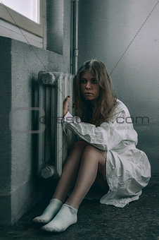 mentally ill girl with straight jacket in a Psychiatric