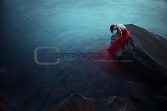 Lonely woman near the sea