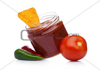 Glass container with hot pepper salsa dip nachos