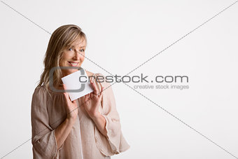 Woman showing holding blank card, note, message