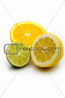 Lemon, Lime and an orange cut in half citrus on a white 