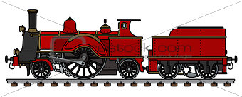 The vintage red steam locomotive