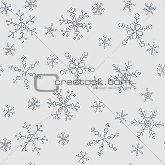 Snowflakes of different styles on a background of gray, pattern