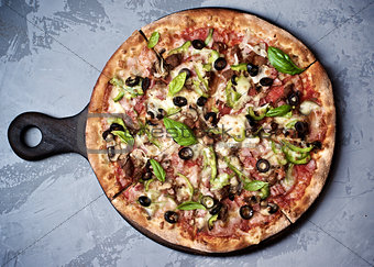 Delicious Pizza with Ham, Olives and Jalapenos
