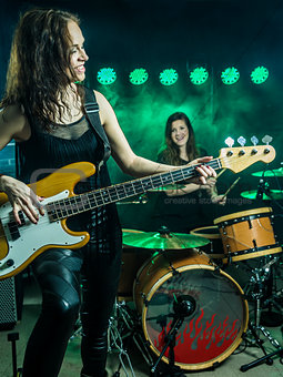 Beautiful women playing in the rock band