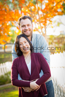 Outdoor Fall Portrait of Chinese and Caucasian Young Adult Coupl