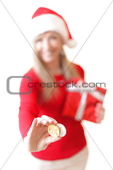 Smiling woman holding two cryptocurrency coins