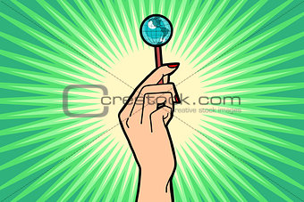Earth Lollipop in female hand