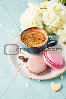 Cup of coffee and macaroons.