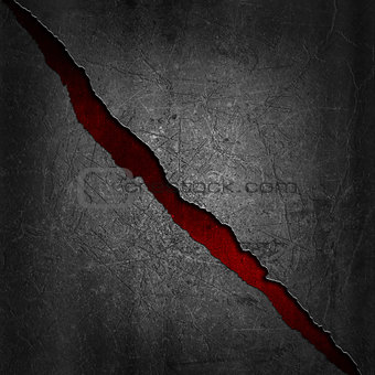 Grunge metal background with red texture showing through the cra
