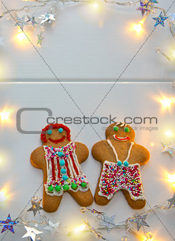 Male and Female Christmas Cookies with garland.