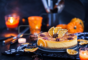 Delicious pumpkin and orange cheesecake decorated with caramel s