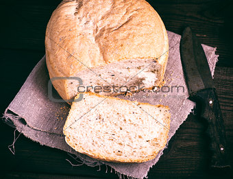 round yeast bread and a kitchen knife 