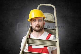 Clumsy worker with ladder
