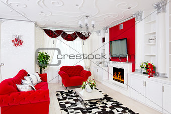 Classical red living room interior with fire place, red furnitur
