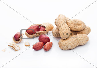 Raw peanuts with shell on white background