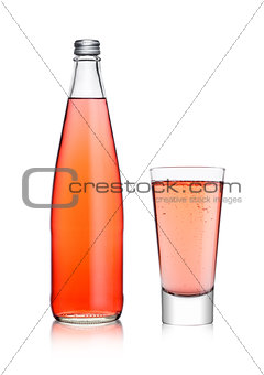 Bottle and glass of sparkling pink soda lemonade