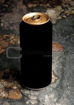 Aluminium can of stout beer top with on stone