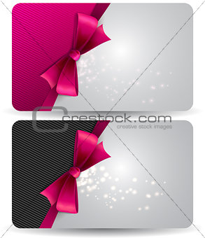 Holiday gift card  with pink ribbons and bow.