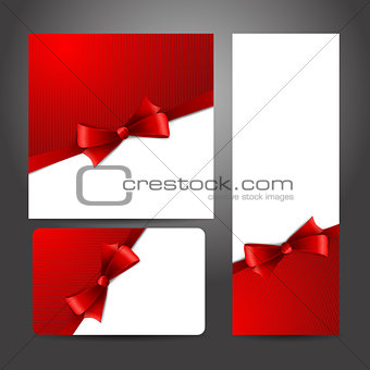 Holiday gift card  with red ribbons and bow.