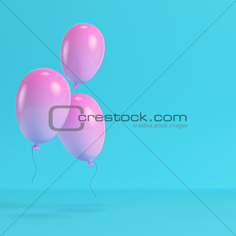 Pink balloons on bright blue background