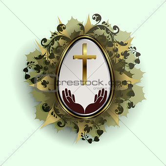 Easter egg with a gold frame and a wreath of leaves