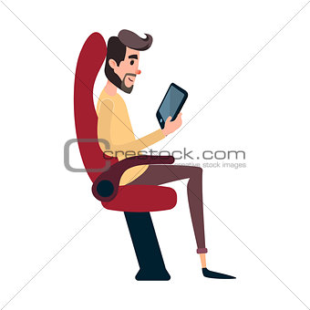 A man is a passenger on a bus or plane. A young man sits in the airplane s chair and looks at the tablet. The bus seat is occupied by the reading man.