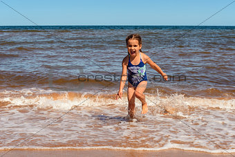 Little girl playing on the Cavendish beach