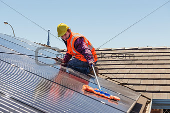 worker and solar panels