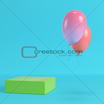 Green box with two flying balloons on bright blue background in 