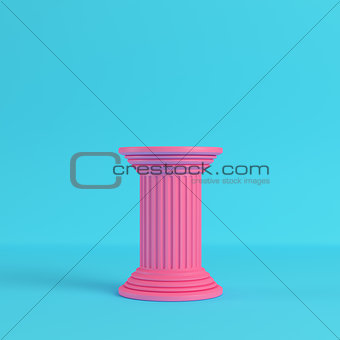 Pink ancient pillar on bright blue background in pastel colors