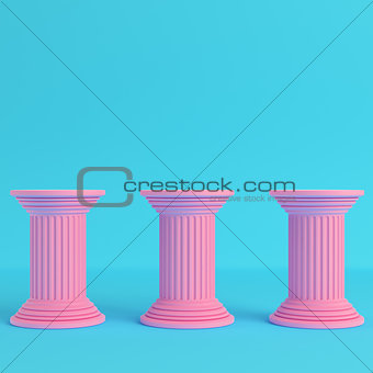 Three ancient pillars on bright blue background in pastel colors