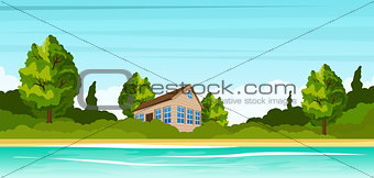 Small house on the river bank. Rural summer landscape